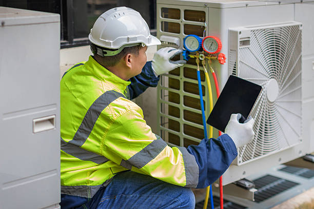 Professional Air Conditioning Repair technician working in Hartville, OH